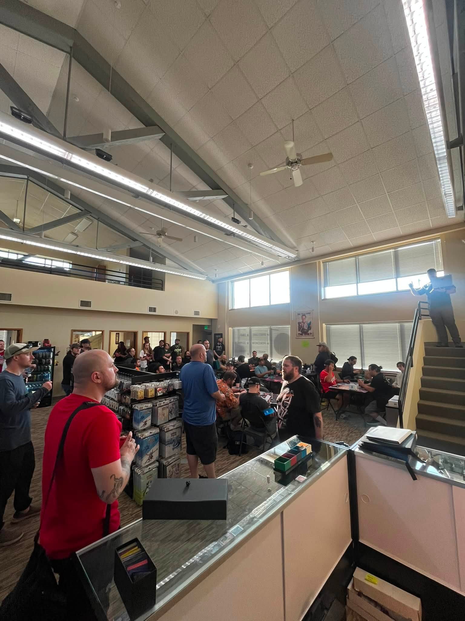 A wide view across a crowded Magic event floor